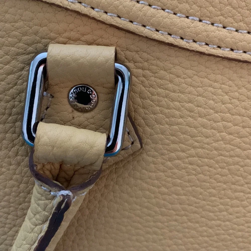 Almost New Dooney and Bourke Satchel with matching wallet. Rich Mustard Color